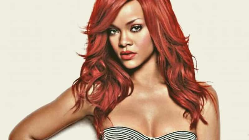 robyn fenty with long and red hair and tanned skin, rihanna miniwki