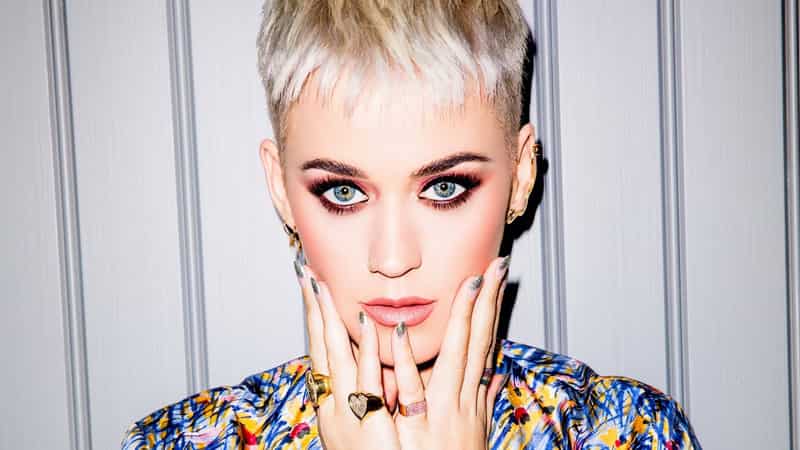 katy perry with smokey eyes and short blonde platinum hair, biggest hot 100 hits